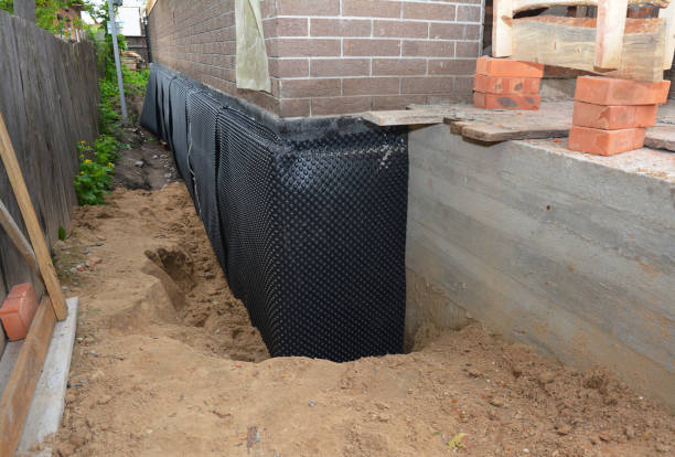 SJ Waterproofing Pros technician performing targeted Interior Drainage System assessment in Eagleville, TN